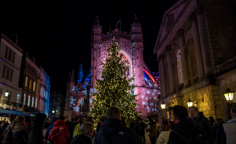 People, stalls and lights at Bath Christmas Market